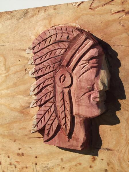 Indian Head chainsaw carving